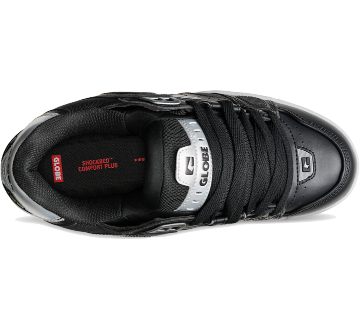 A black GLOBE athletic sneaker shown from a top-down perspective on a white background, featuring black laces, a black mesh and leather upper, a silver tongue label, and red branding details.