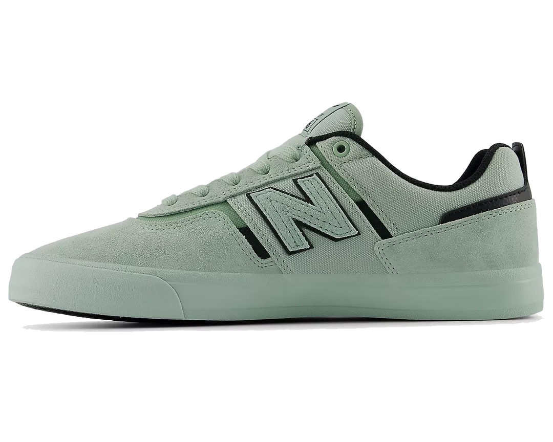 Light green sneaker with New Balance logo on a white background