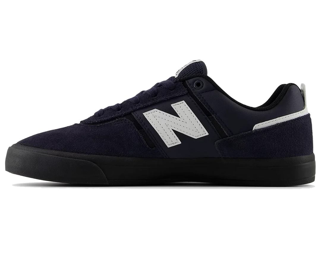 Navy blue sneaker with a white logo on a white background
