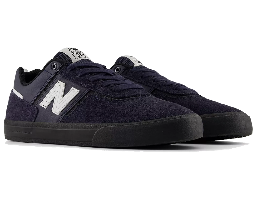 Pair of navy blue sneakers with white logo on a white background