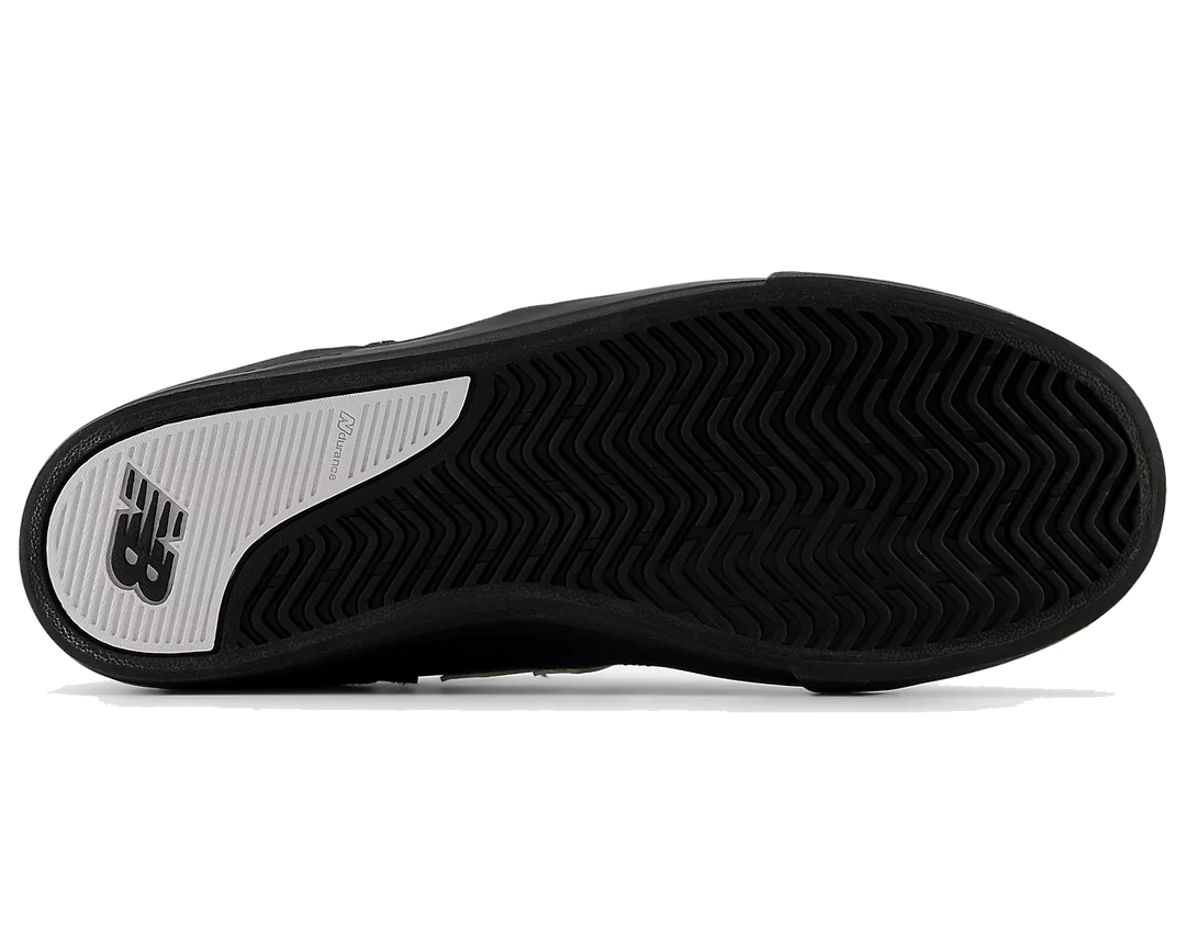 Black sneaker with a white sole on a white background