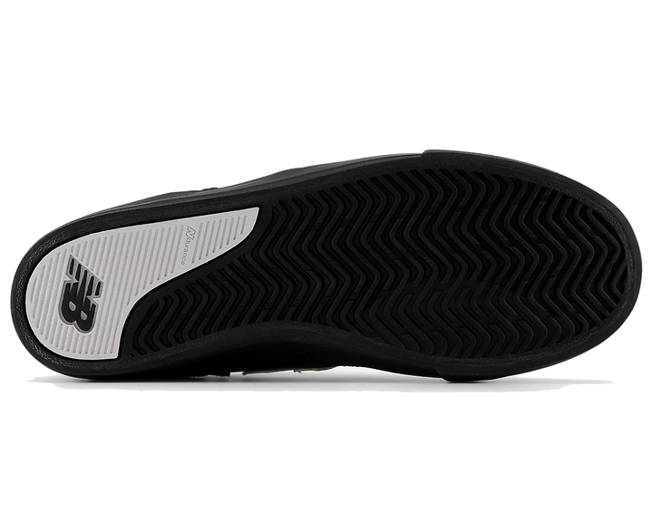 Black sneaker with a white sole on a white background