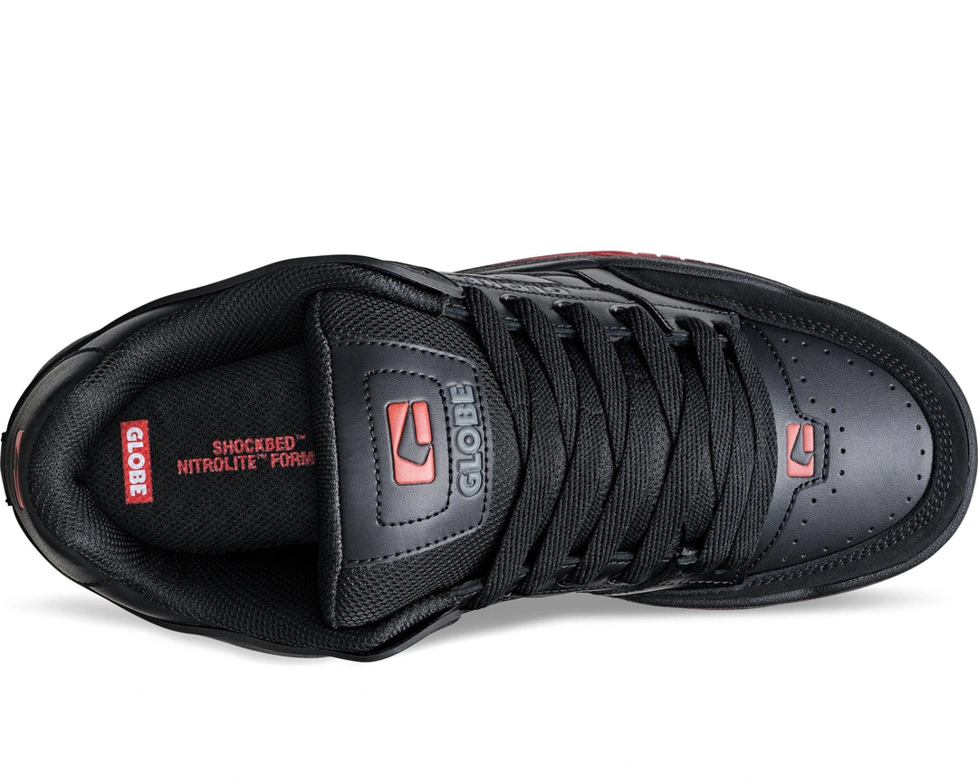 Black sneaker with red accents on a white background