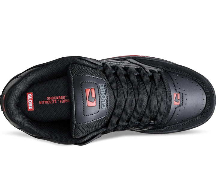 Black sneaker with red accents on a white background