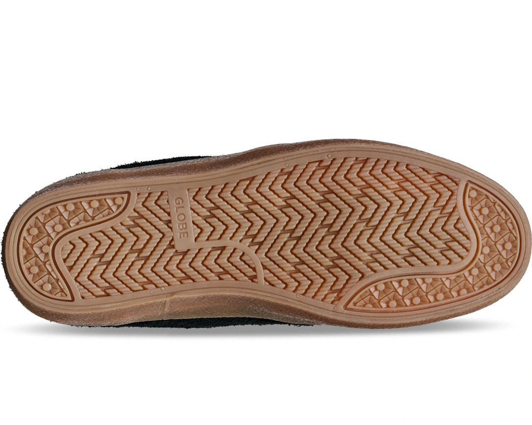 Close-up of a shoe sole with tread pattern on a white background
