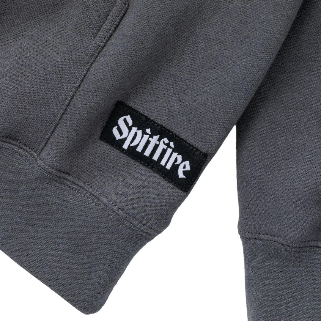 Gray sweatshirt with a Spitfire logo on the sleeve