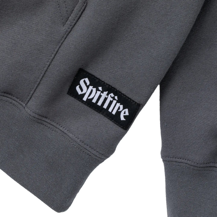 Gray sweatshirt with a Spitfire logo on the sleeve