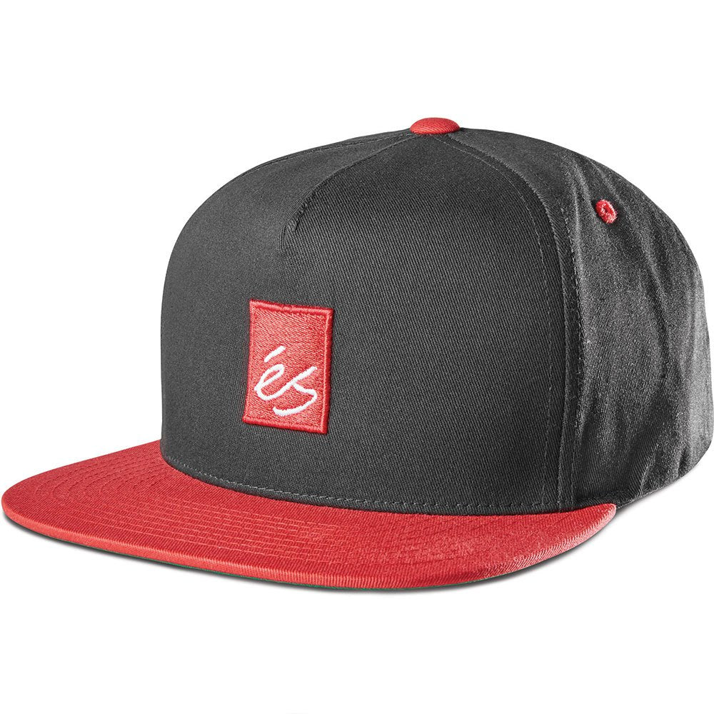 éS Main Block Snapback Hat in black with bold red embroidered block logo, flat brim, and adjustable snapback closure.